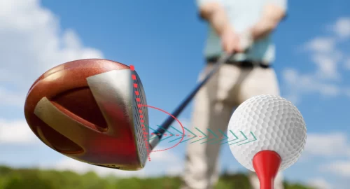 Golfer about to hit a ball