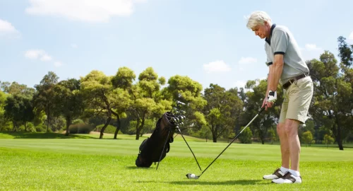 Golfer standing on a golf course